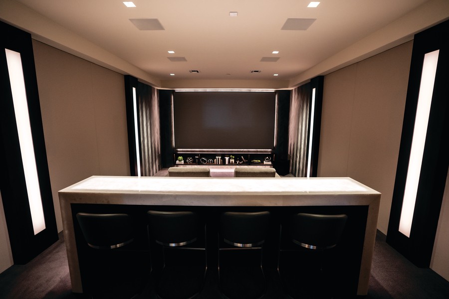  A Colorado home theater with Sonance architectural speakers installed in the walls and ceiling.