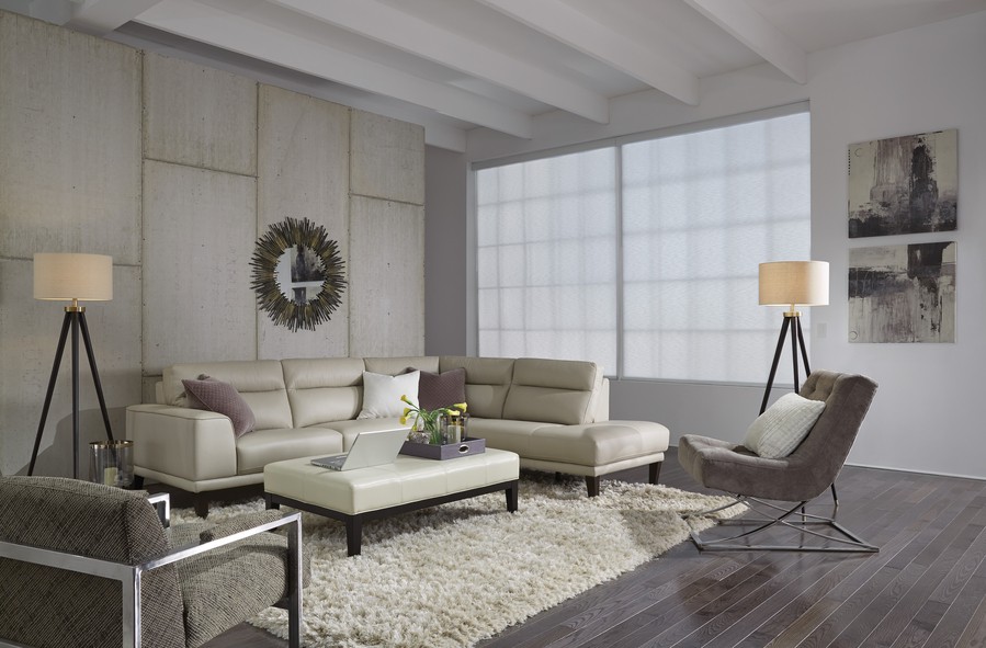 A chic living room in Boulder featuring motorized shades, offering a sleek design and diffused natural light for a modern, relaxed ambiance.