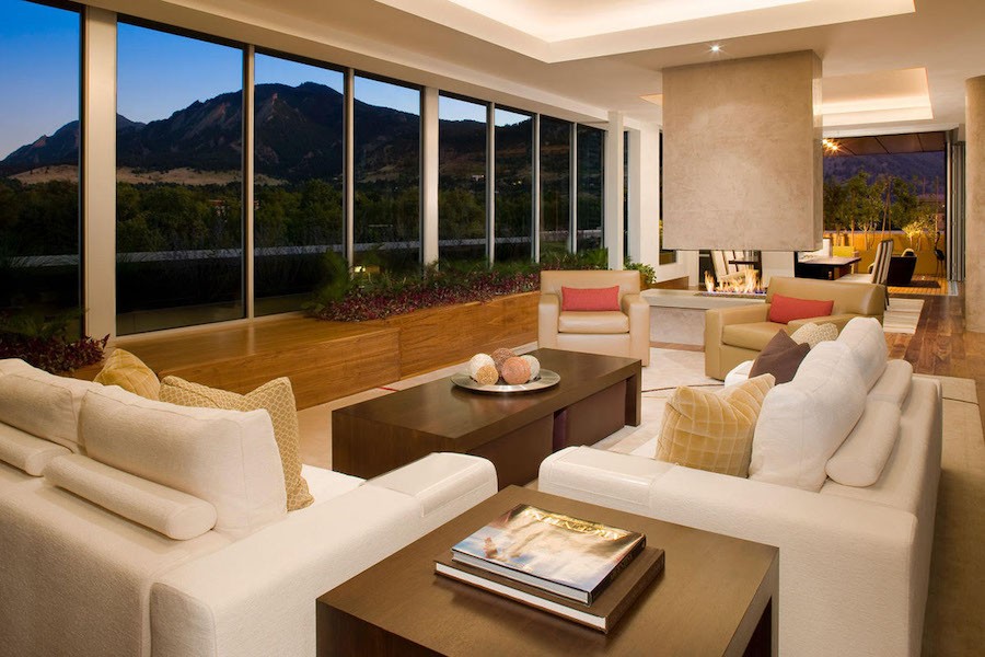 A Colorado Springs home's living room with lighting automation, showcasing elegant interior design against the backdrop of mountain views.