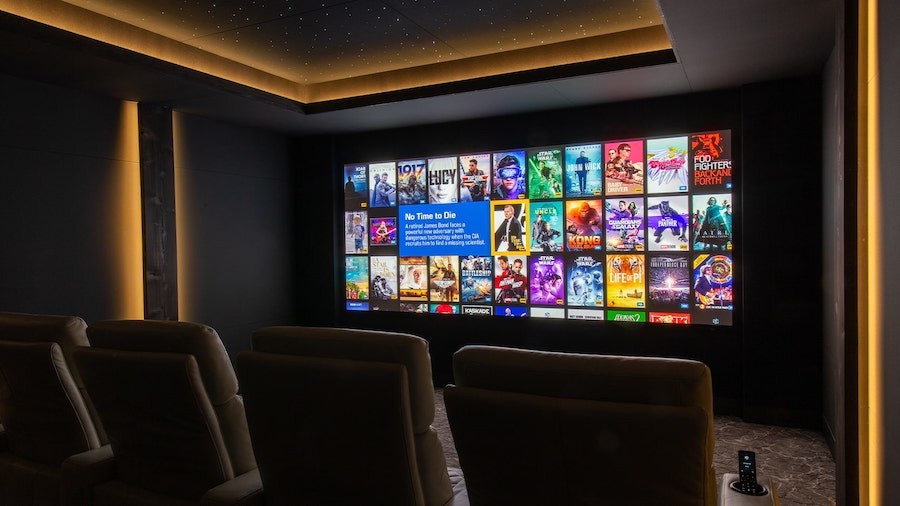 A view of Aurum’s showroom home cinema featuring Steinway audio and custom lighting. 